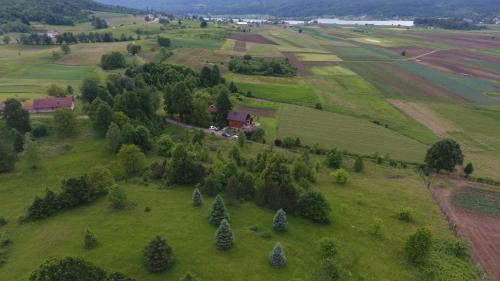 an aerial view of a green field with trees at Kuća za odmor ANAMARIJA in Ogulin