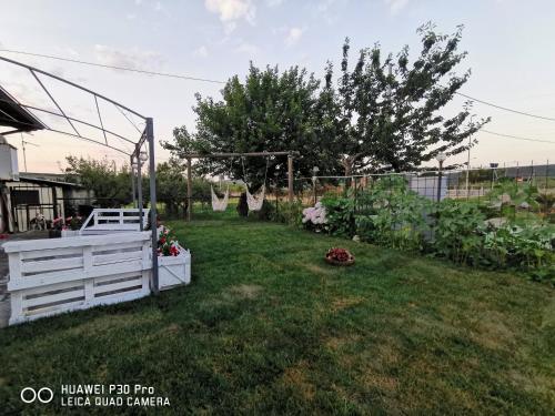 a backyard with a white fence and a garden at Bed And Breakfast "ANNA" in Bagnara Calabra