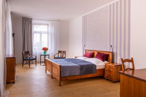 Postel nebo postele na pokoji v ubytování Penzion U Madony