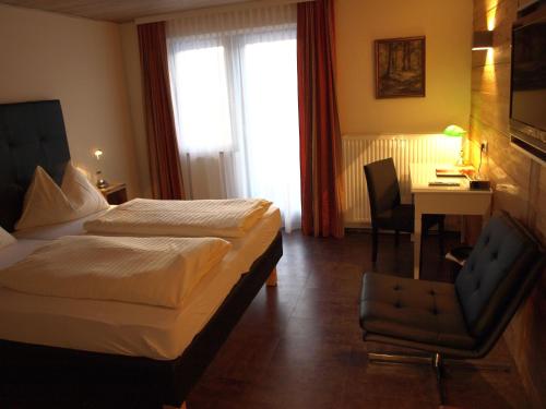 Postel nebo postele na pokoji v ubytování Hotel Aloisia, Hotel Garni