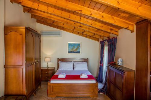 Giường trong phòng chung tại Lagonisi Villa VIP