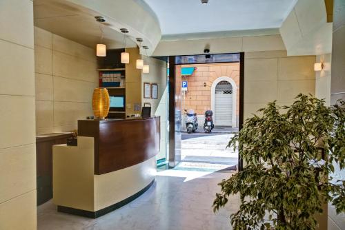 a lobby of a building with a scooter in the background at Crosti Hotel in Rome