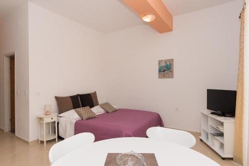 מיטה או מיטות בחדר ב-Apartments Lovrić