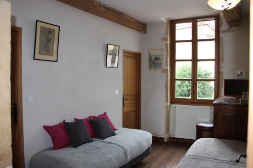 Ένα ή περισσότερα κρεβάτια σε δωμάτιο στο Le Relais Des Dames