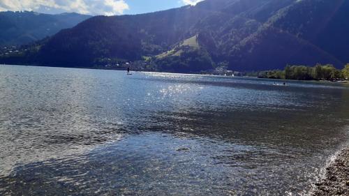 a large body of water with mountains in the background at Wildente am See in Maishofen