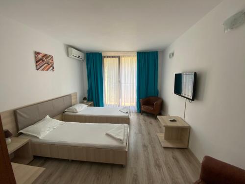 Postel nebo postele na pokoji v ubytování Q Hotel