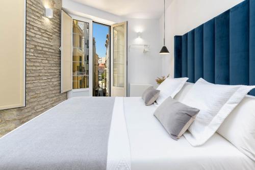 Posteľ alebo postele v izbe v ubytovaní iloftmalaga San Juan