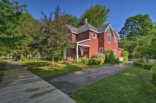 a red brick house with a driveway at Northwest Michigan Duplex half Mi to Lake Michigan in Charlevoix
