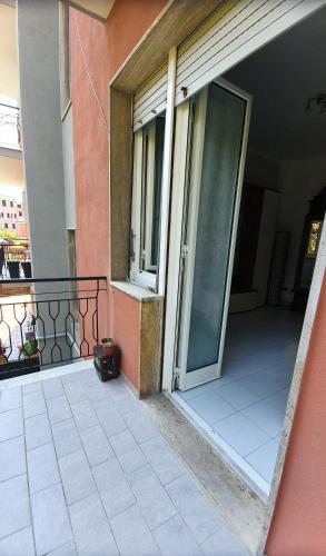an open door to a balcony of a building at COMODO AL MARE in Lerici