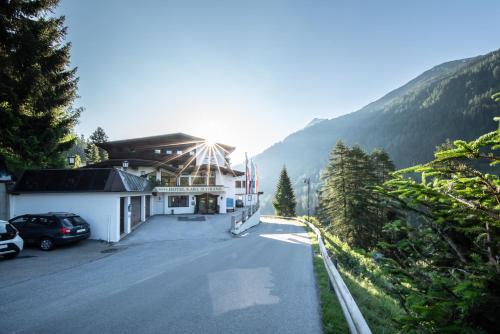 a building on the side of a mountain at Hotel Karl Schranz in Sankt Anton am Arlberg