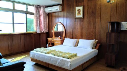 Кровать или кровати в номере Pu Su Garden Bed and Breakfast