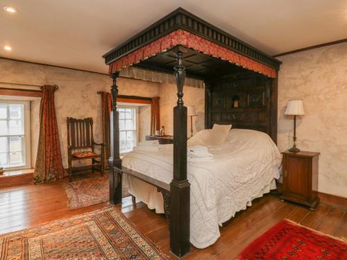 a bedroom with a large bed in a room at The Pend in Newton Stewart