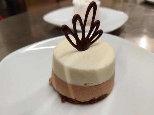 a piece of chocolate cake on a white plate at Il pozzo dei desideri in Castelnuovo