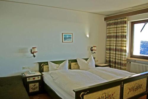 Ein Bett oder Betten in einem Zimmer der Unterkunft Panoramahotel Alde Hotz GbR
