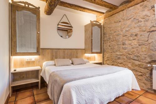 Кровать или кровати в номере Posada del Rodeno