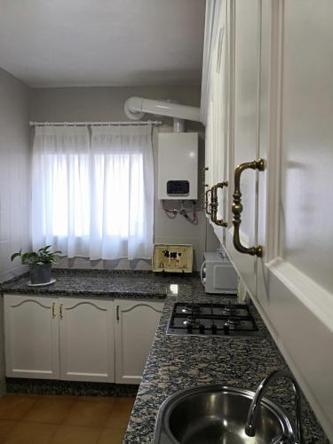 a kitchen with a sink and a counter top at Medina Baguh (VFT) in Priego de Córdoba