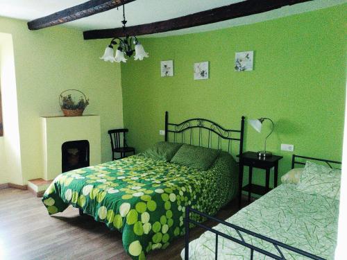 Postel nebo postele na pokoji v ubytování Casa Rurales Antigua Casa del Relojero