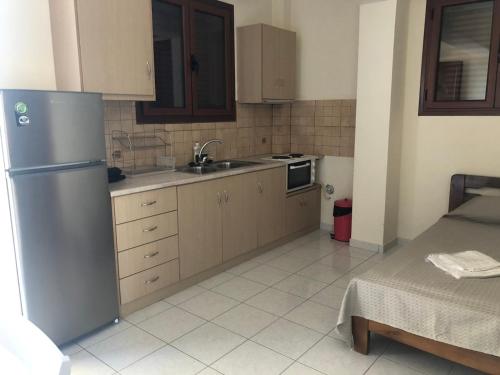 Kuchyň nebo kuchyňský kout v ubytování Savvas Apartments