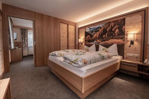 Postel nebo postele na pokoji v ubytování Hotel Garni Sonnenheim