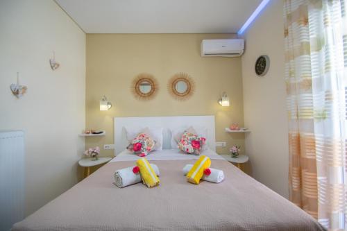 a bedroom with a bed with four pillows on it at Private Villa Bella Luna by "elite" in Zakynthos