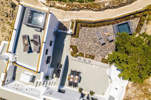 an overhead view of a white house with a patio at Noelia Suites in Oia
