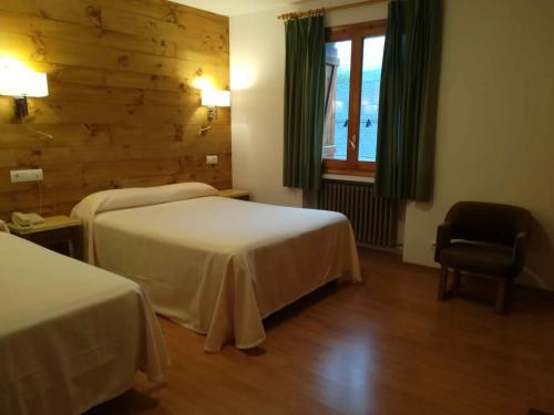Postel nebo postele na pokoji v ubytování Hotel Vicente