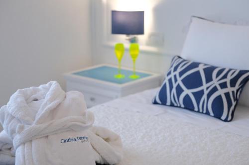 a hotel room with a bed with a towel and a lamp at Hermitage Resort & Thermal Spa in Ischia