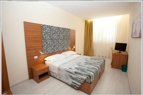 Postel nebo postele na pokoji v ubytování Hotel Elys
