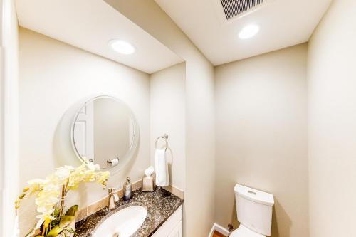 a bathroom with a sink and a mirror at Waterfront Getaway in Poulsbo