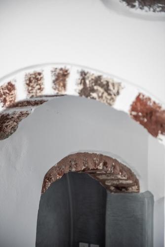 a chocolate cake on top of a tv at Noelia Suites in Oia