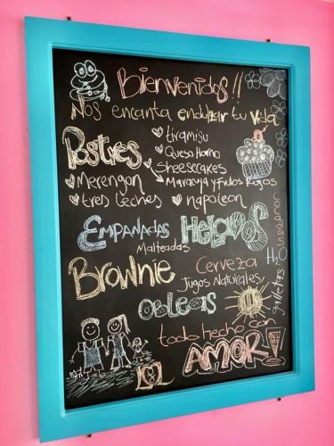a chalkboard with a bunch of writing on it at Villa Nova Condominio in La Plata