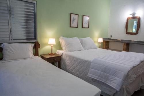 Postel nebo postele na pokoji v ubytování Hotel Fazenda Sete Lagos