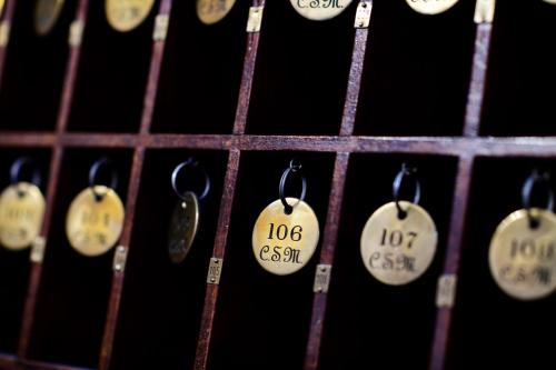 a bunch of key tags on a wine rack at Casa de Sao Mamede Hotel in Lisbon