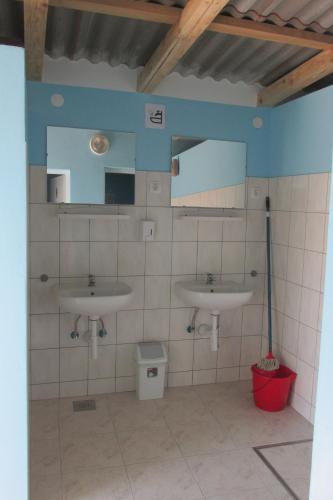 a bathroom with two sinks and a mirror at Caravan near the sea 4 in Ugljan