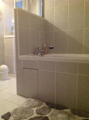 a bathroom with a sink and a mirror at Le Saint Aubin- Maison d hôtes dans ce monastère du 16 siècle in Amfreville-la-Campagne