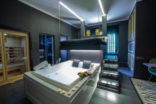 a bathroom with a tub and a bunk bed at Love Suite Roma - Il Nido d'Amore in Rome