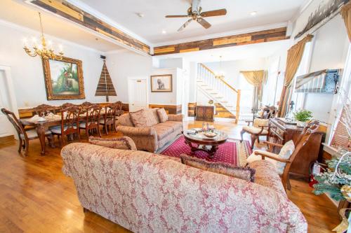 a living room with a couch and a table at Carriage Way Centennial House - Adult Only- Saint Augustine in St. Augustine