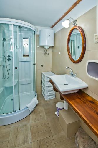 a bathroom with a sink and a shower at Apartments Villa Marcelina in Hvar