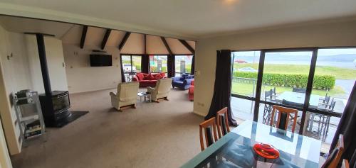 a living room with a view of a living room at Accent On Taupo Motor Lodge in Taupo