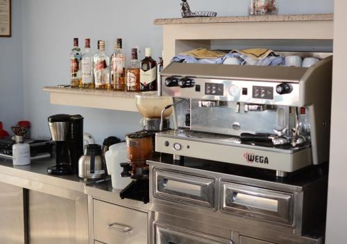 a kitchen with a coffee maker on top of a stove at Philoxenia Hotel in Lefkandi Chalkidas