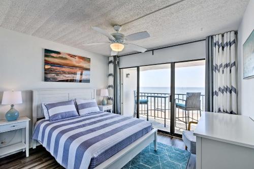 a bedroom with a bed with a view of the ocean at Bright Galveston Condo with Ocean View and Balcony! in Galveston