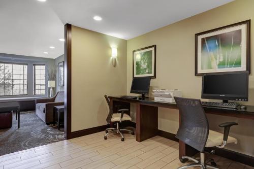 a hotel room with a desk with a computer at Staybridge Suites Washington D.C. - Greenbelt by IHG in Lanham