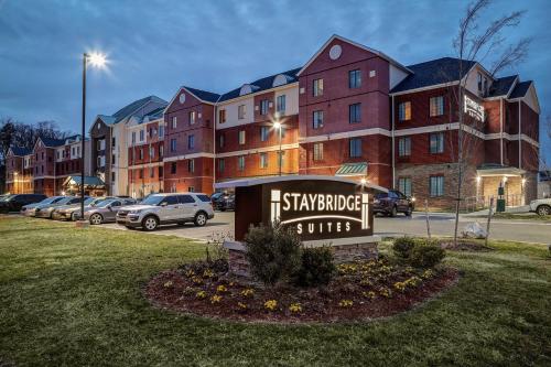 a sign in front of a building with cars parked at Staybridge Suites Washington D.C. - Greenbelt by IHG in Lanham