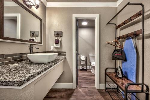 a bathroom with a white sink and a toilet at The Elet Hotel in South Lake Tahoe