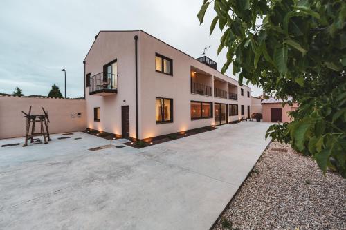 a large white building with a lot of windows at Hotel rural La Tejera in Quintanilla de Arriba