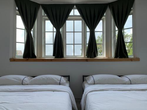 מיטה או מיטות בחדר ב-The Hill at Fraser Hill