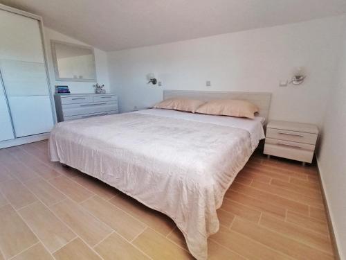 Katil atau katil-katil dalam bilik di Vacation house Punta sunca