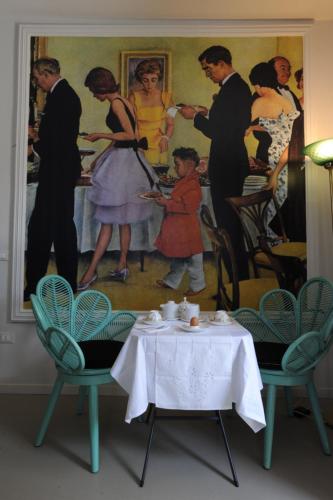 a dining room with a table and a painting at Palazzo Scura in Vaccarizzo Albanese