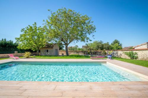 a swimming pool in the backyard of a house at L'Escale de Jules et Lily in Bligny-lès-Beaune