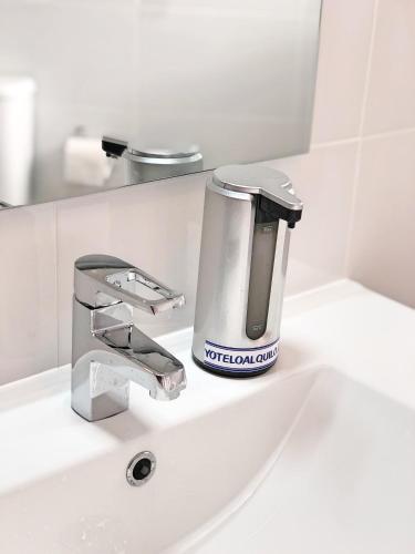 a soap dispenser sitting on top of a bathroom sink at Las Gondolas 602 in Almuñécar